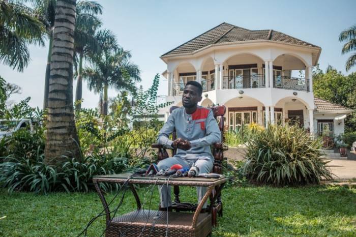 Bobi Wine giving a press conference outside his home, credit: campus times