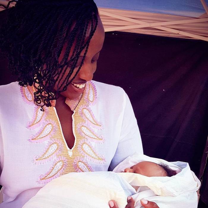 Natasha Museveni holding a child
