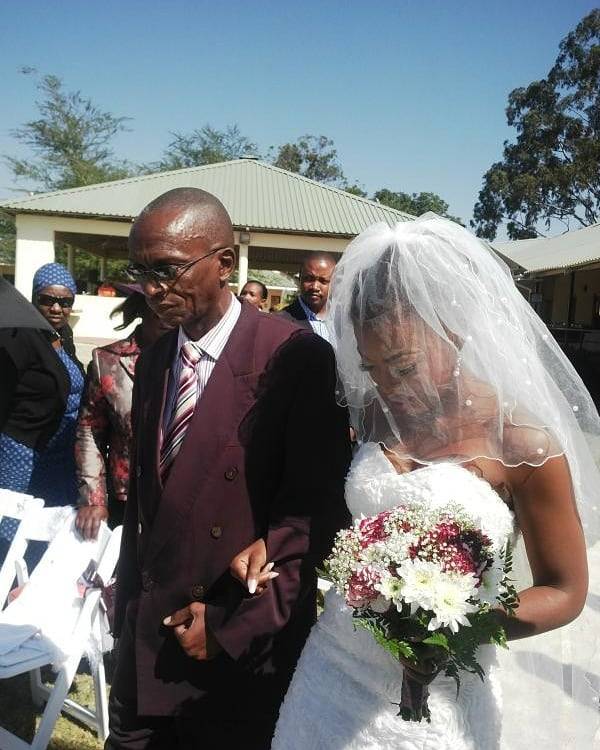 Samantha Mogwe father on her wedding day